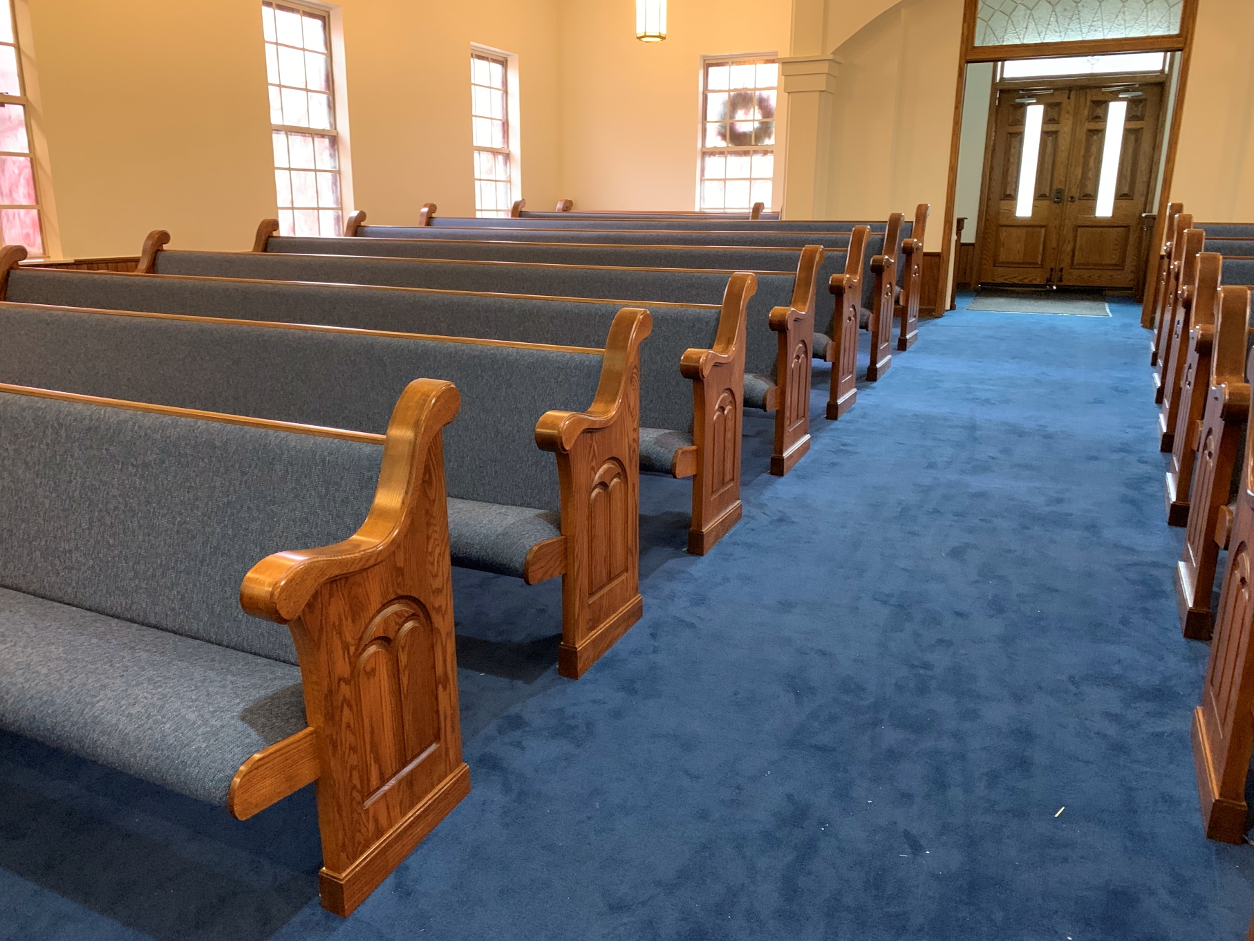 New Church Pews with Traditional Pew Ends installed recently in Banner Elk, North Carolina by Woods Church Interiors