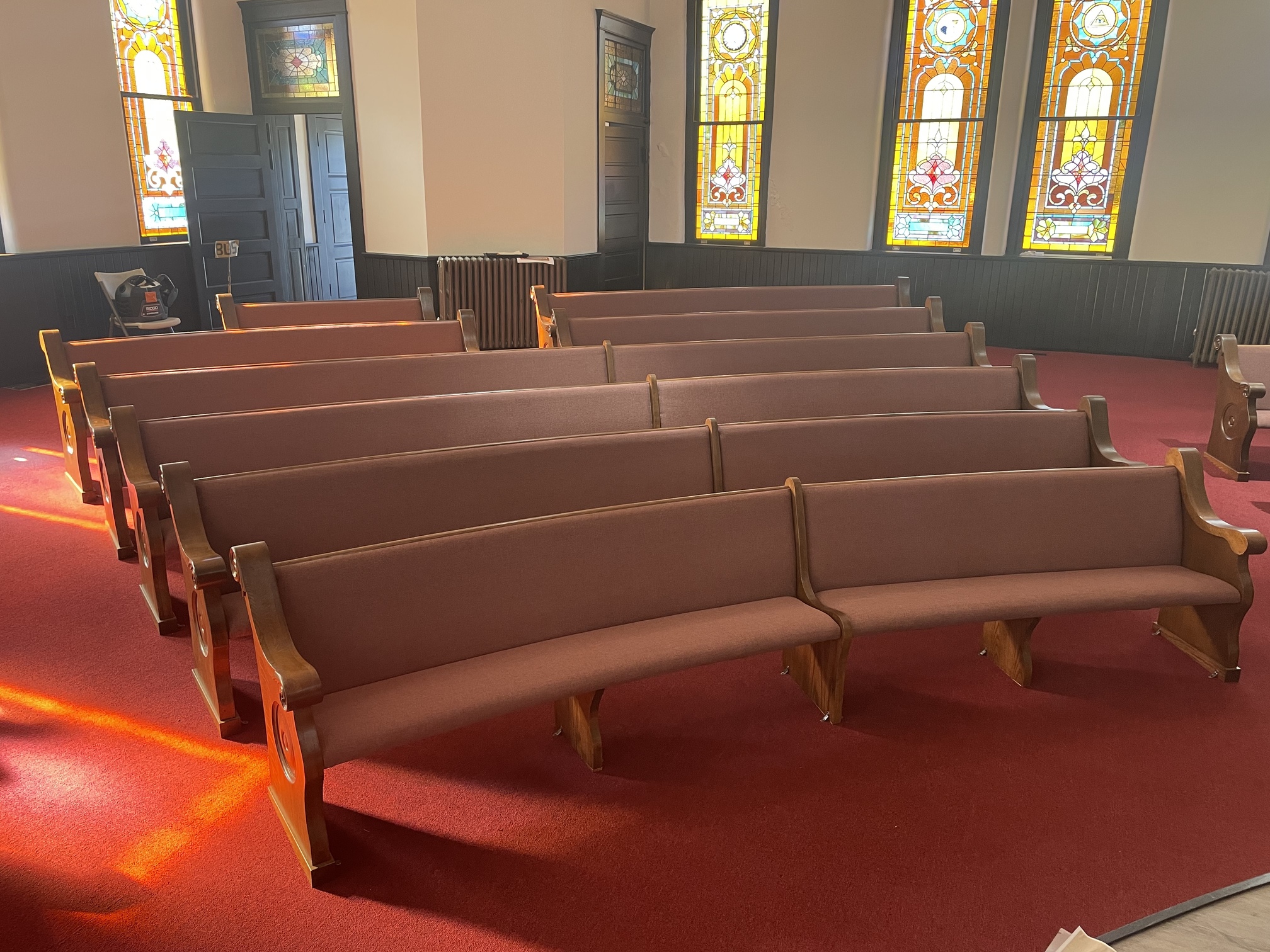 center bank of pews at Hopewell Missionary Baptist in Nashville, Tennessee newly restored by Woods church Interiors after they were severely damaged by tornado.