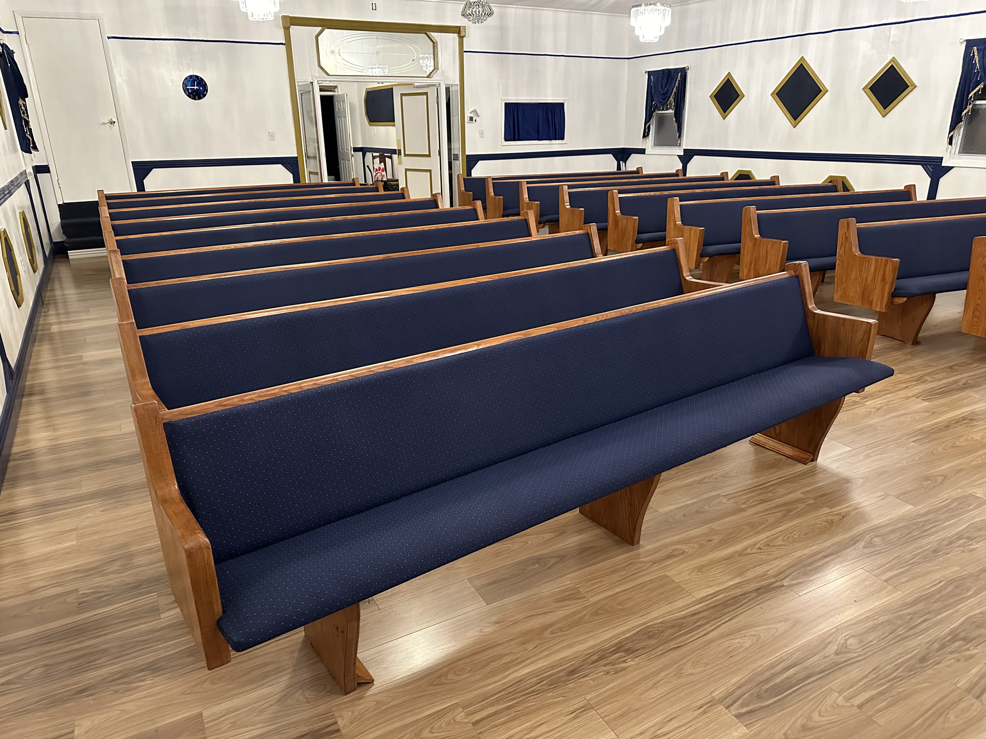 closer right front view of church pew upholstery Elizabethtown Kentucky performed by Woods Church Interiors nationwide pew upholstery service